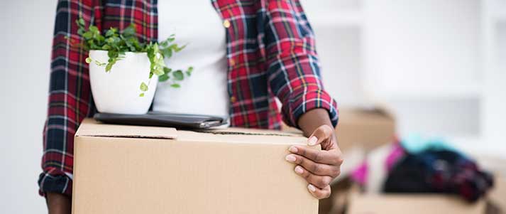 Woman with boxes moving out