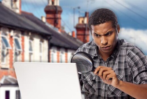 man using magnifying glass with terrace background