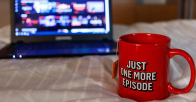 netflix cup and laptop