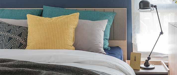 bedding with colourful cushions