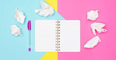 notebook against colourful background