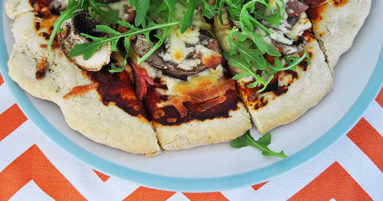 homemade rocket and mushroom pizza