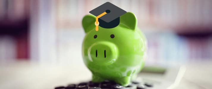 piggy bank wearing a graduate hat