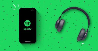 spotify-iphone-and-headphones-on-a-green-background