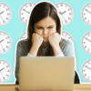 Stressed unhappy angry girl laptop clocks wall time desk