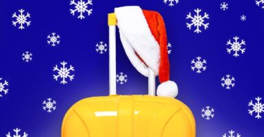 Suitcase with santa hat