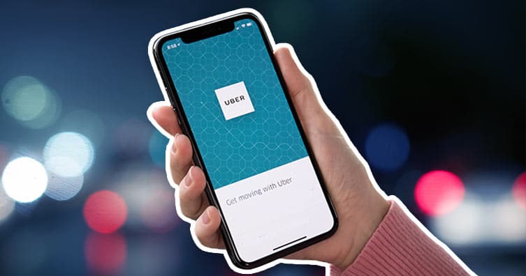 hand holding phone with uber app