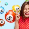 woman crossing fingers in front of lottery balls