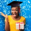 Woman with graduation cap holding present