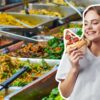 woman with pizza in buffet